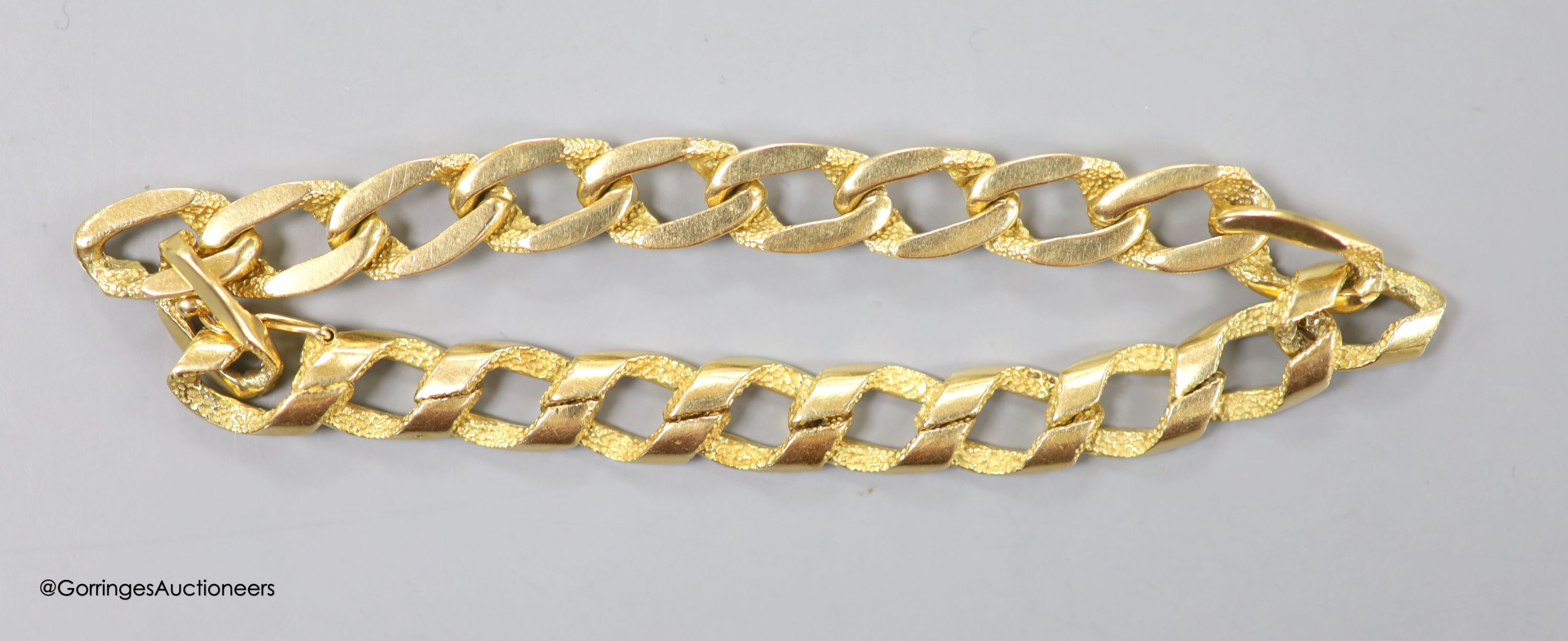 An 750 yellow metal fancy curb-link bracelet, 34.6g